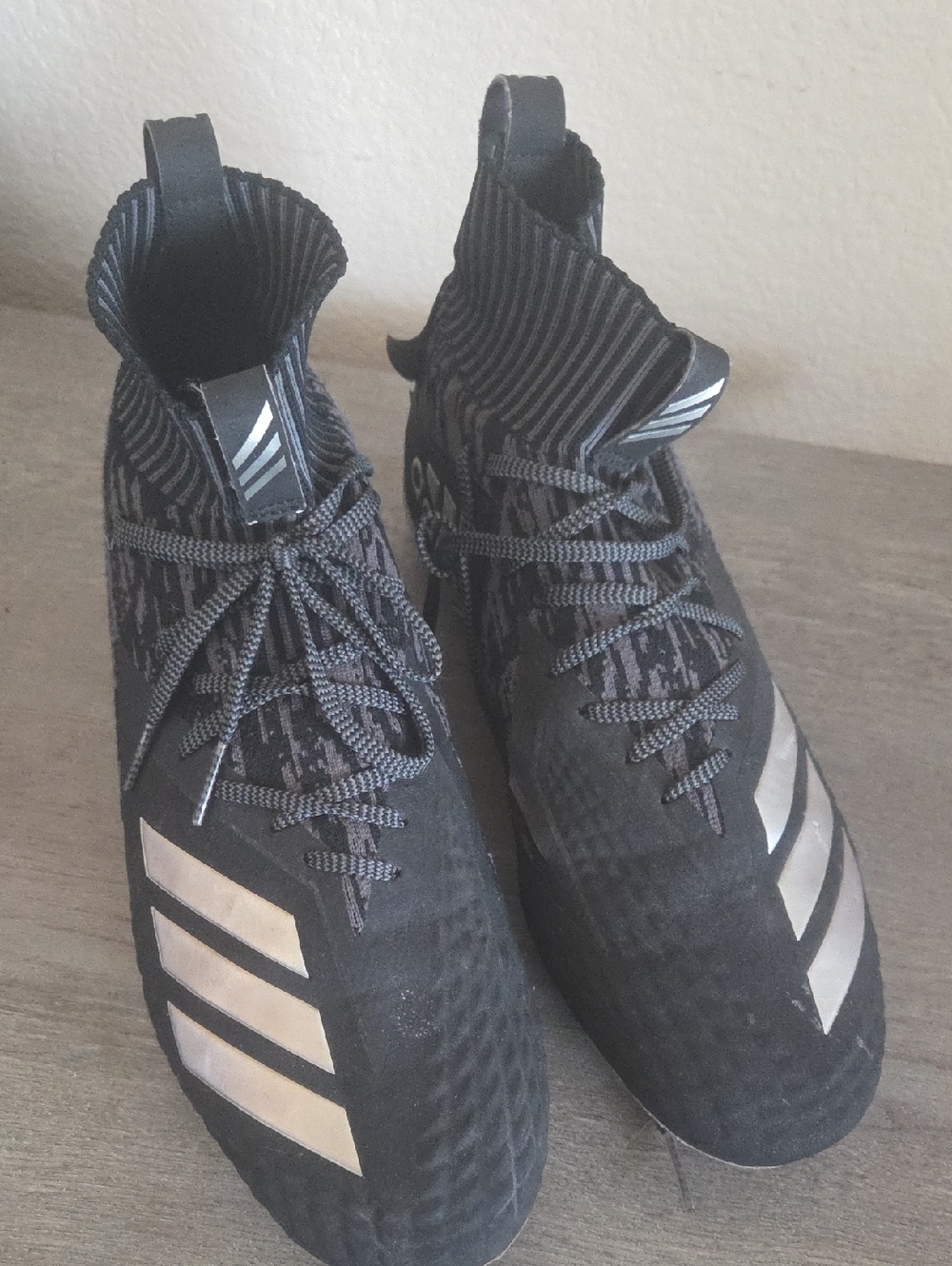 adidas Black High-Top Football Cleats with Metallic Accents